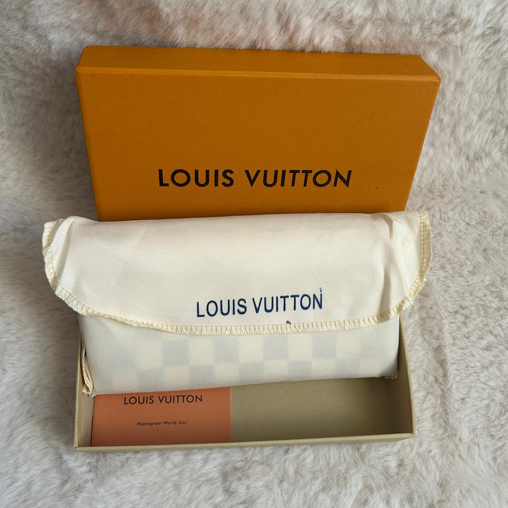 Pochette zippée blanche motif monogramme