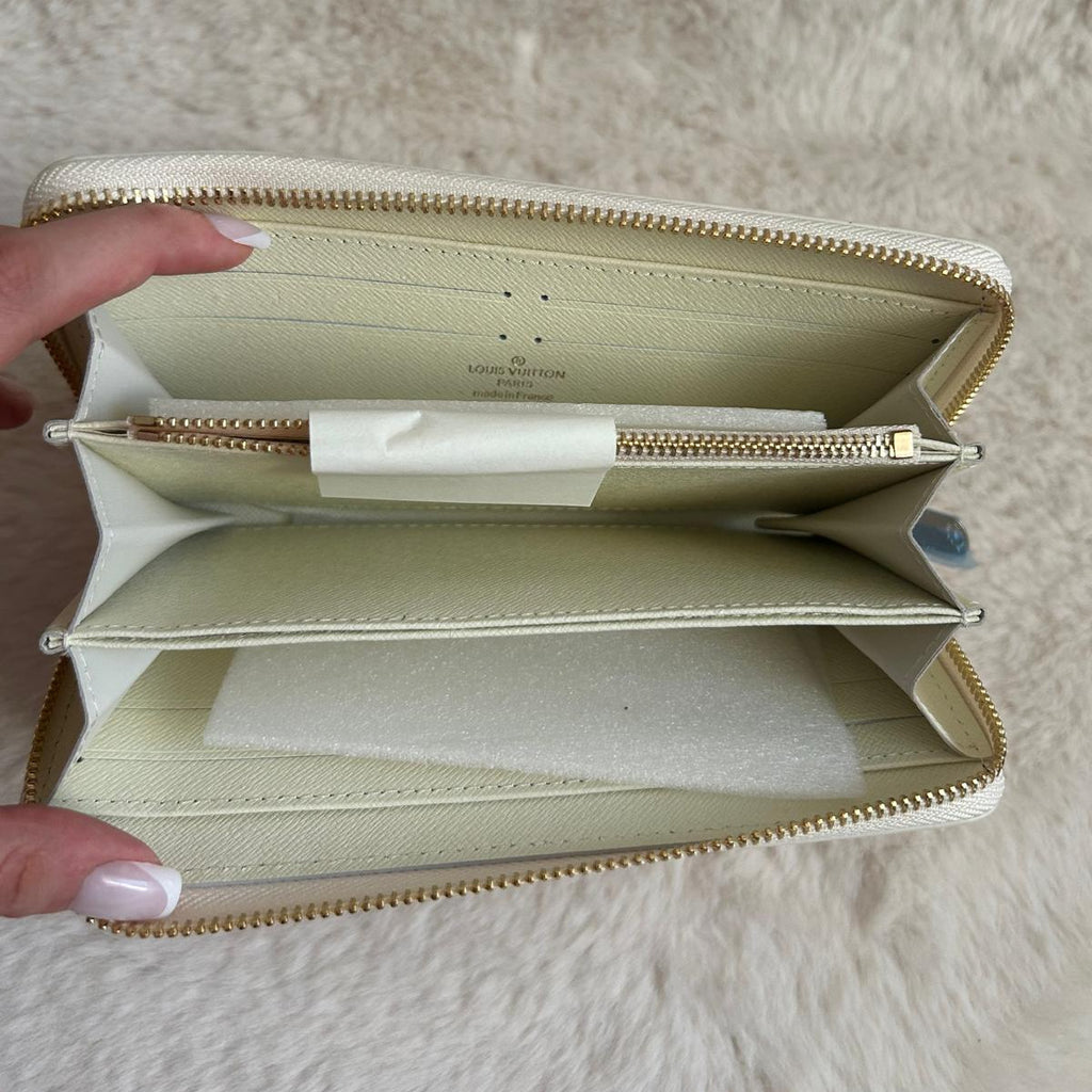 Pochette zippée blanche motif monogramme