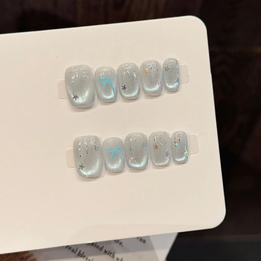 Faux ongles à pression Amande Moyen Bleu Argenté Dégradé Étoiles Nœud Flash Diamant - Faits main (Lot de 10)