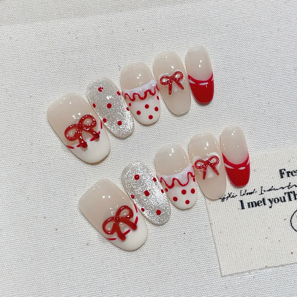Faux ongles à pression Ovale Moyen Nude Pois Rouge Nœud Argenté – Faits main (Lot de 10)