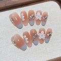 Faux ongles Ovales Pêche Fleur Étoile– Faits main (Lot de 10)