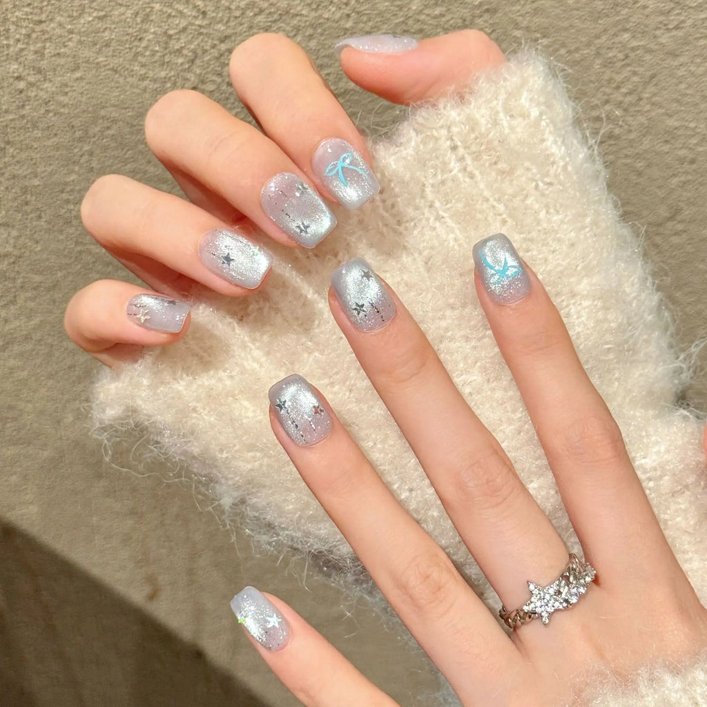 Faux ongles à pression Amande Moyen Bleu Argenté Dégradé Étoiles Nœud Flash Diamant - Faits main (Lot de 10)