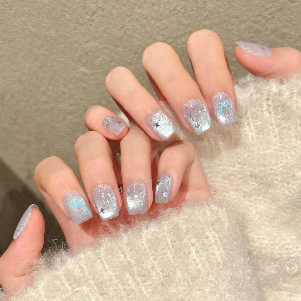 Faux ongles à pression Amande Moyen Bleu Argenté Dégradé Étoiles Nœud Flash Diamant - Faits main (Lot de 10)
